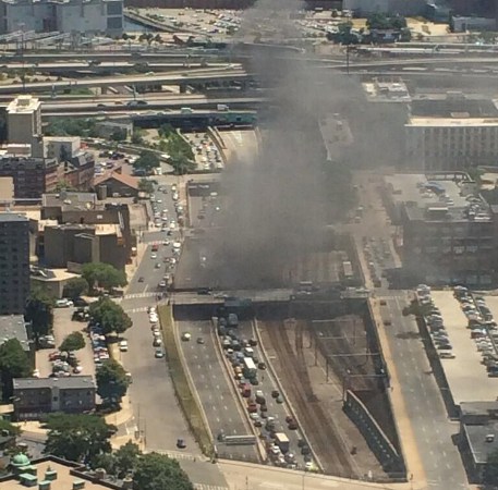 Smoke rises from turnpike car fire in Boston