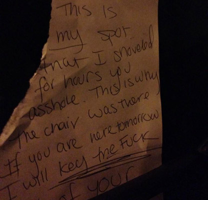 Angry note demanding the space saver be put back