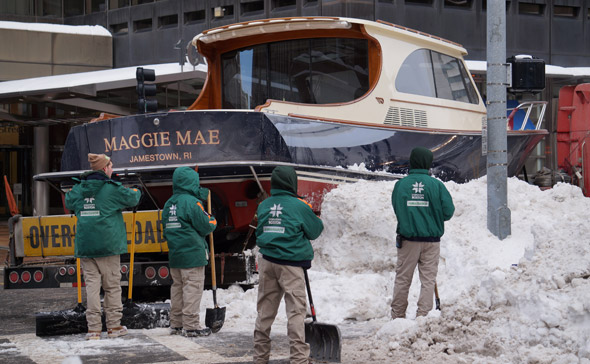 stuck boat with shovelers