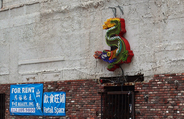 Condemned building with Chinese neon