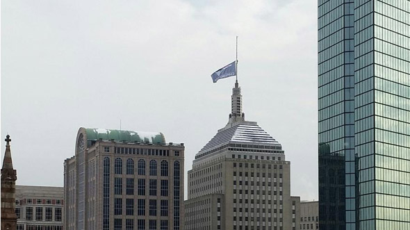 Attaching the Patriots banner to the Old Hancock