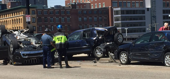 Flipped cars and two struck cars