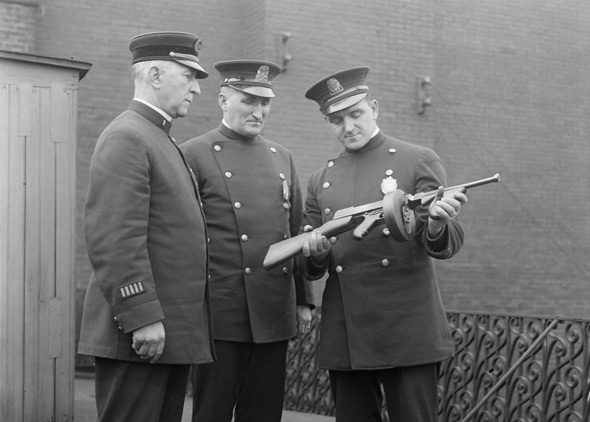 Boston officers with a machine gun