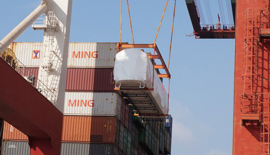 Mockup Orange Line car being loaded on a ship in China