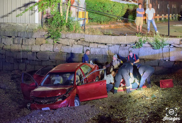 Car in the mud after crash in East Boston