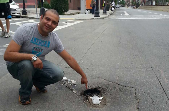 Pointing out a hole on Huntington Avenue