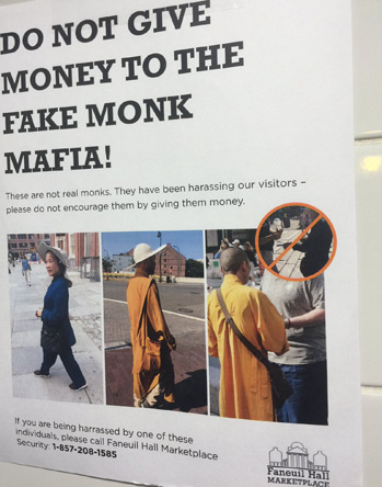 Sign at Faneuil Hall warning against fake monks