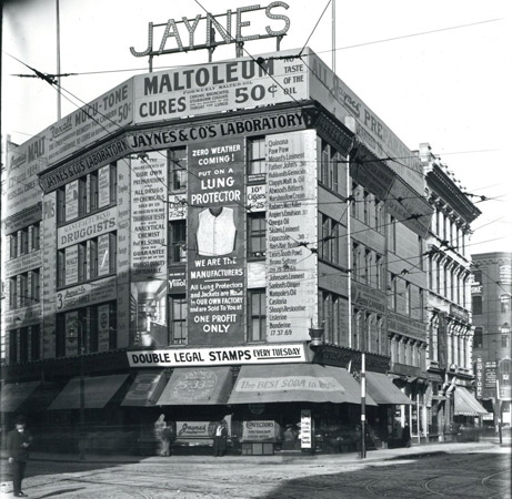 Lots of signs on building in old Boston