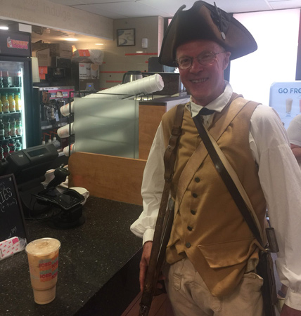 Minuteman picking up a Dunkin' Donuts iced coffee