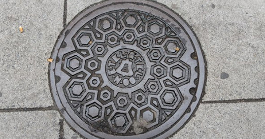 New England Telephone and Telegraph Co. manhole cover on Essex Street in Chinatown