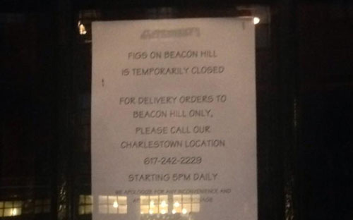 Message in window of Beacon Hill Figs announces another shutdown.