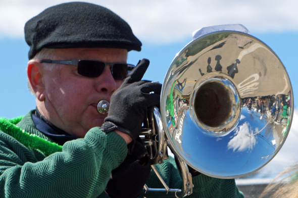 Man in Scituate parade with a horn