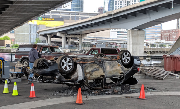 Car turned turtle under the Zakim Bridge