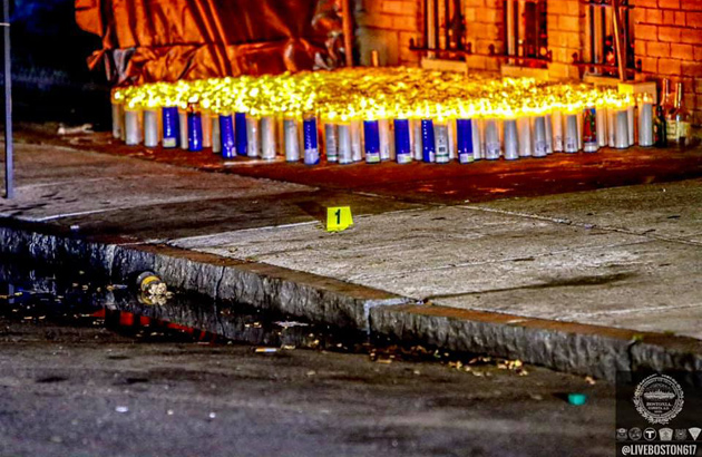 Evidence marker and candles on Circuit Street