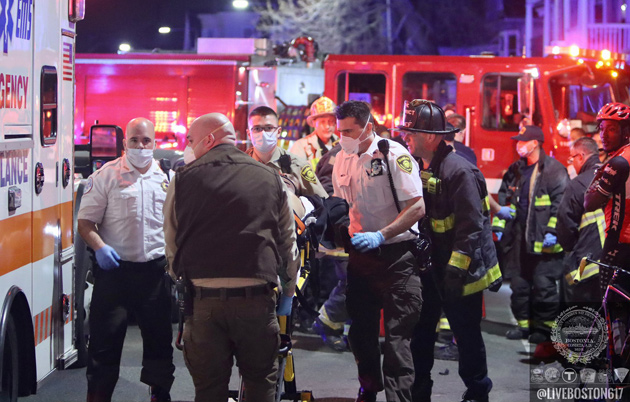 Patient being loaded into ambulance on Columbia Road