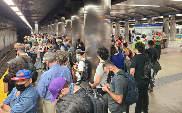 Passengers waiting for a train that isn't coming at Maverick