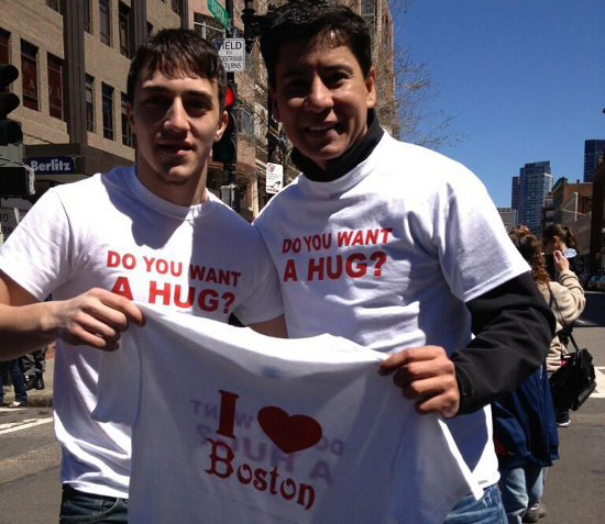 Two guys offering free hugs