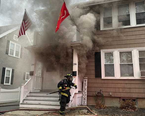 Heavy smoke pouring out of house