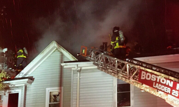 Boston firefighters at fire on Albano Street in Roslindale