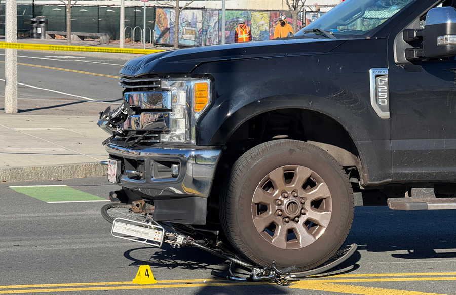 Remains of the bike under the wheels of a pickup