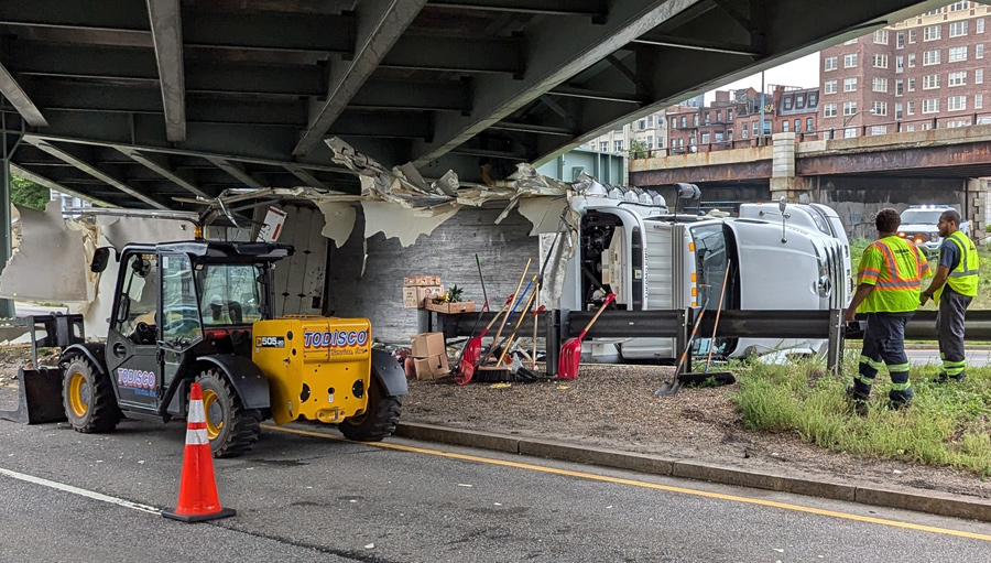 Crew tries to remove storrowed truck at Bowker Overpass