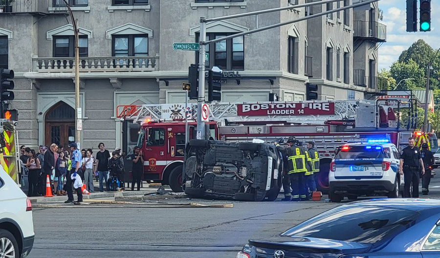 Flipped SUV at Commonwealth and Harvard avenues