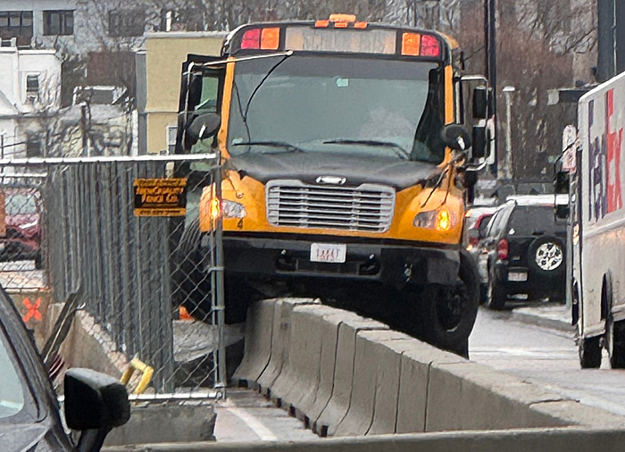 Bus wound up atop Jersey barriers at Guest and Arthur streets