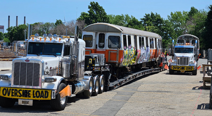 Last two old-school Orange Line cars moving out from Wellington yard