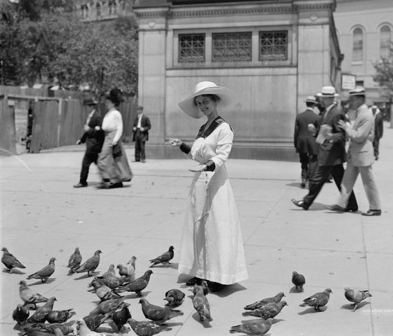 Feeding pigeons at Park Street station