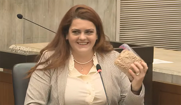 Alaina Gonzalez-White holding some of the birth-control pellets.