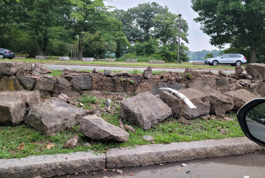 Knocked over stone wall across from Jamaica Pond