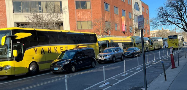 Long line of yellow shuttle buses