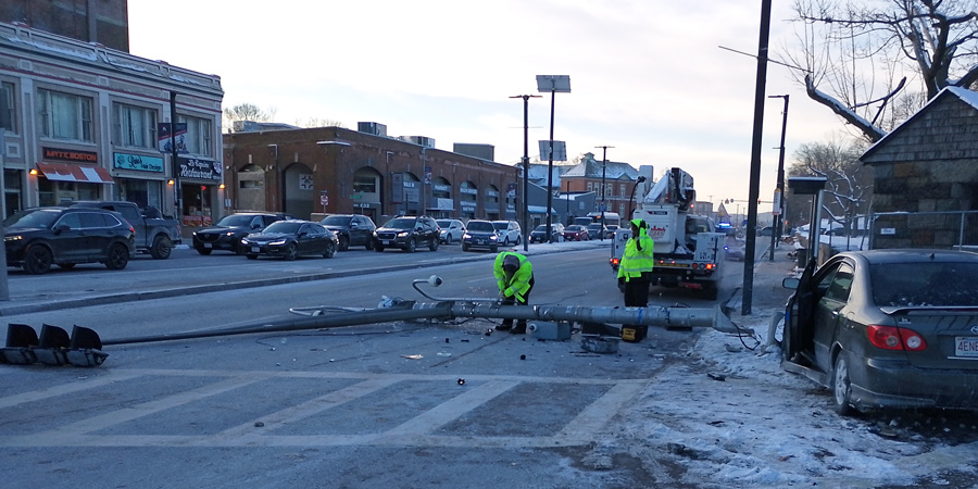 BTD workers begin removing pole, with car that hit it still at the scene