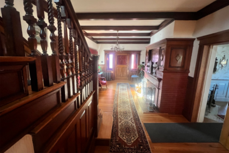 On the first floor, looking toward the entrance, 19th-century wood paneling abounds