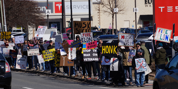 More protesters with signs