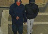 Surveillance photo of two masked suspects