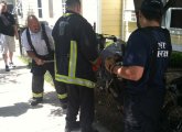 Firefighters cutting bolts on dirt bikes at Mission Main project