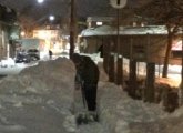 Ed Coppinger shoveling a bridge in West Roxbury