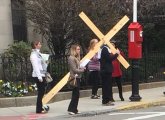 Man with a cross on Longwood Avenue