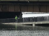 Rising tide under North Washington Street bridge