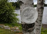 Warning about West Nile Virus on a paper plate at Jamaica Pond