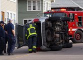 Partially flipped SUV in Roslindale