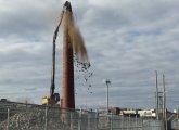 Smokestack being torn down