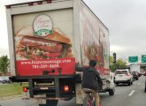 Bicyclist holding onto truck on I-93