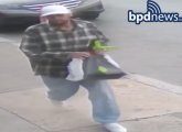 Suspect in checkered shirt with Stop & Shop bag