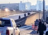 Frustrated bus riders give up and walk onto McGrath Highway to get to Lechmere