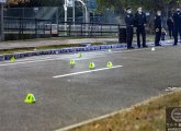 Evidence markers and cops on Martin Luther King Boulevard