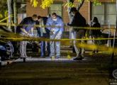 Detectives examine evidence on Parker Street