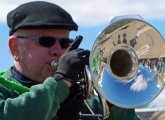 Man in Scituate parade with a horn