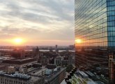 Sunset over Cambridge, reflected on the Hancock